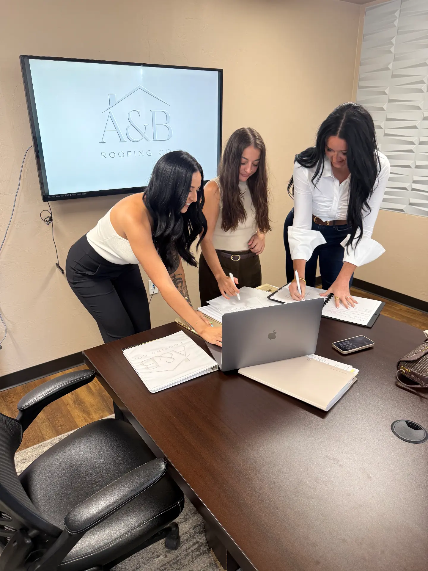 The team reviewing paperwork together at the office