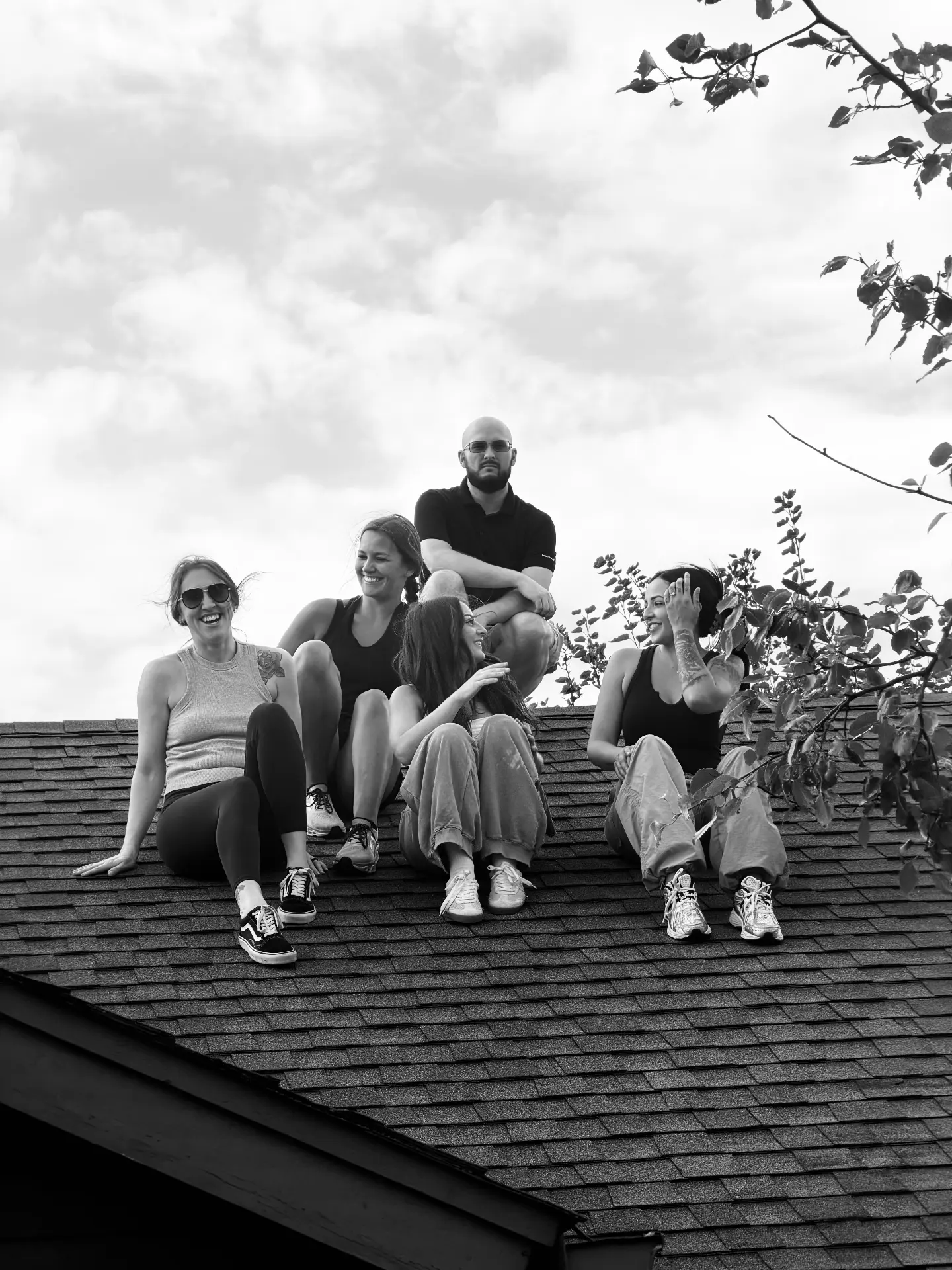 The A & B team sitting together on a rooftop
