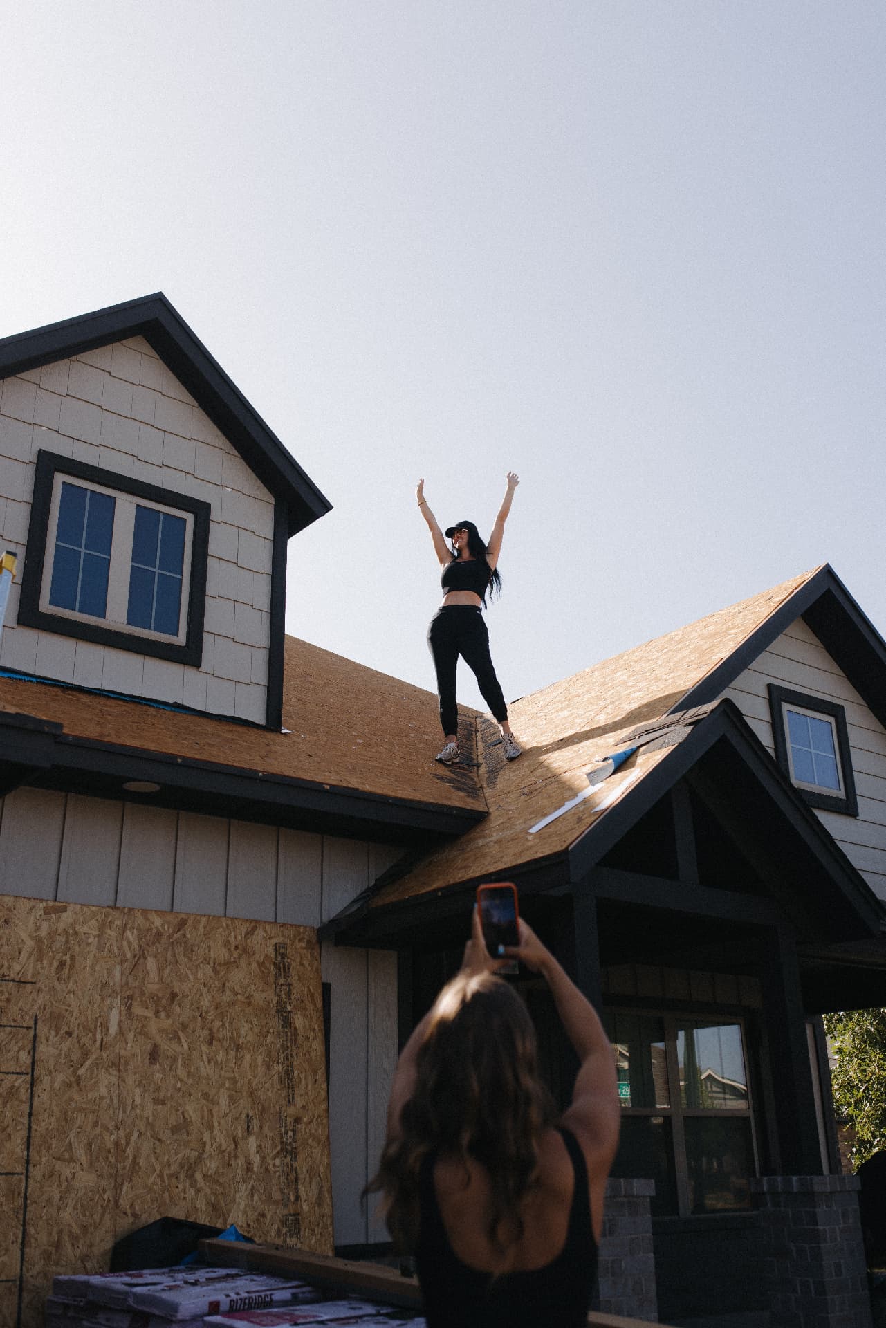 Celebrating on a roof deck during a tear off
