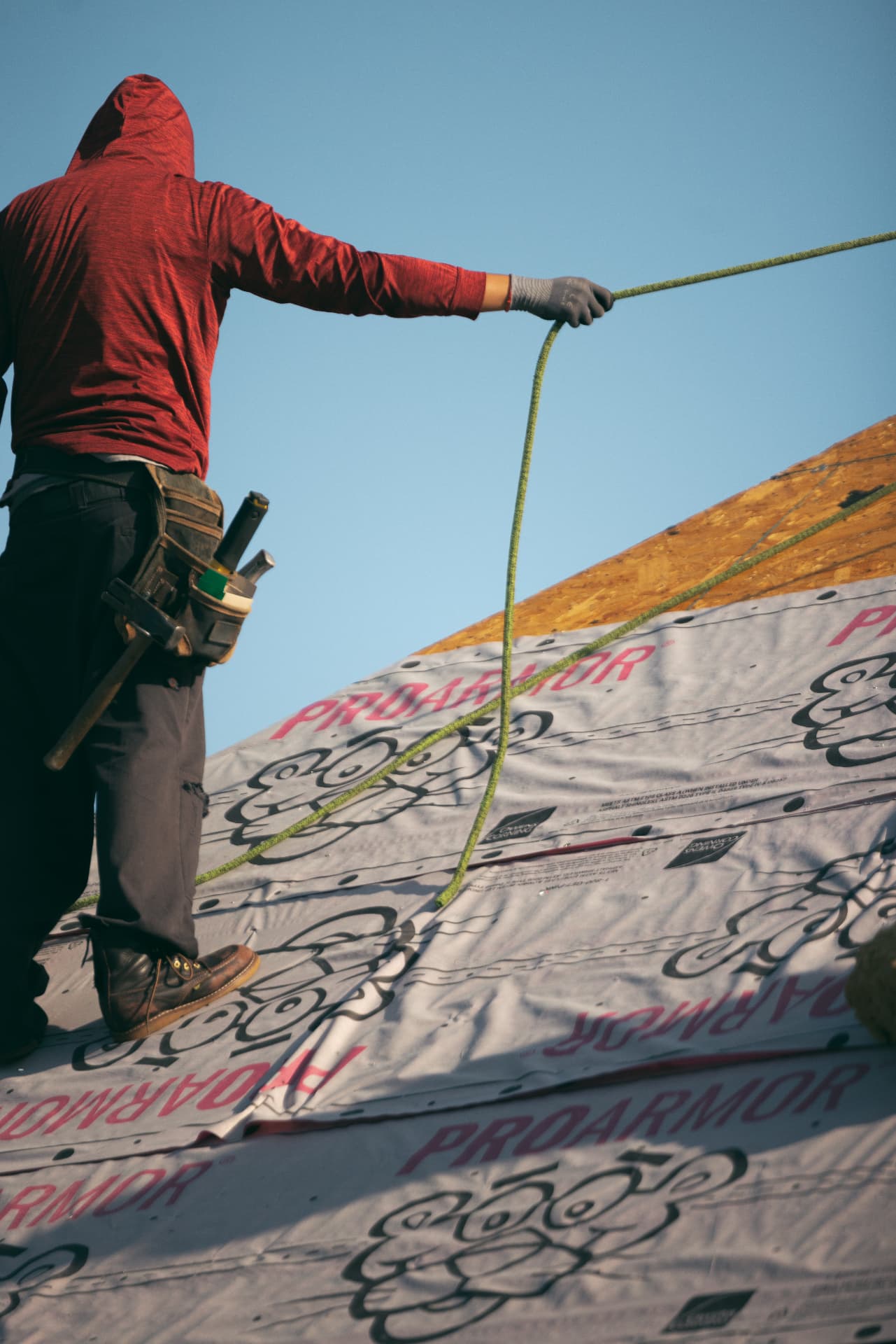 Pulling a line across fresh underlayment