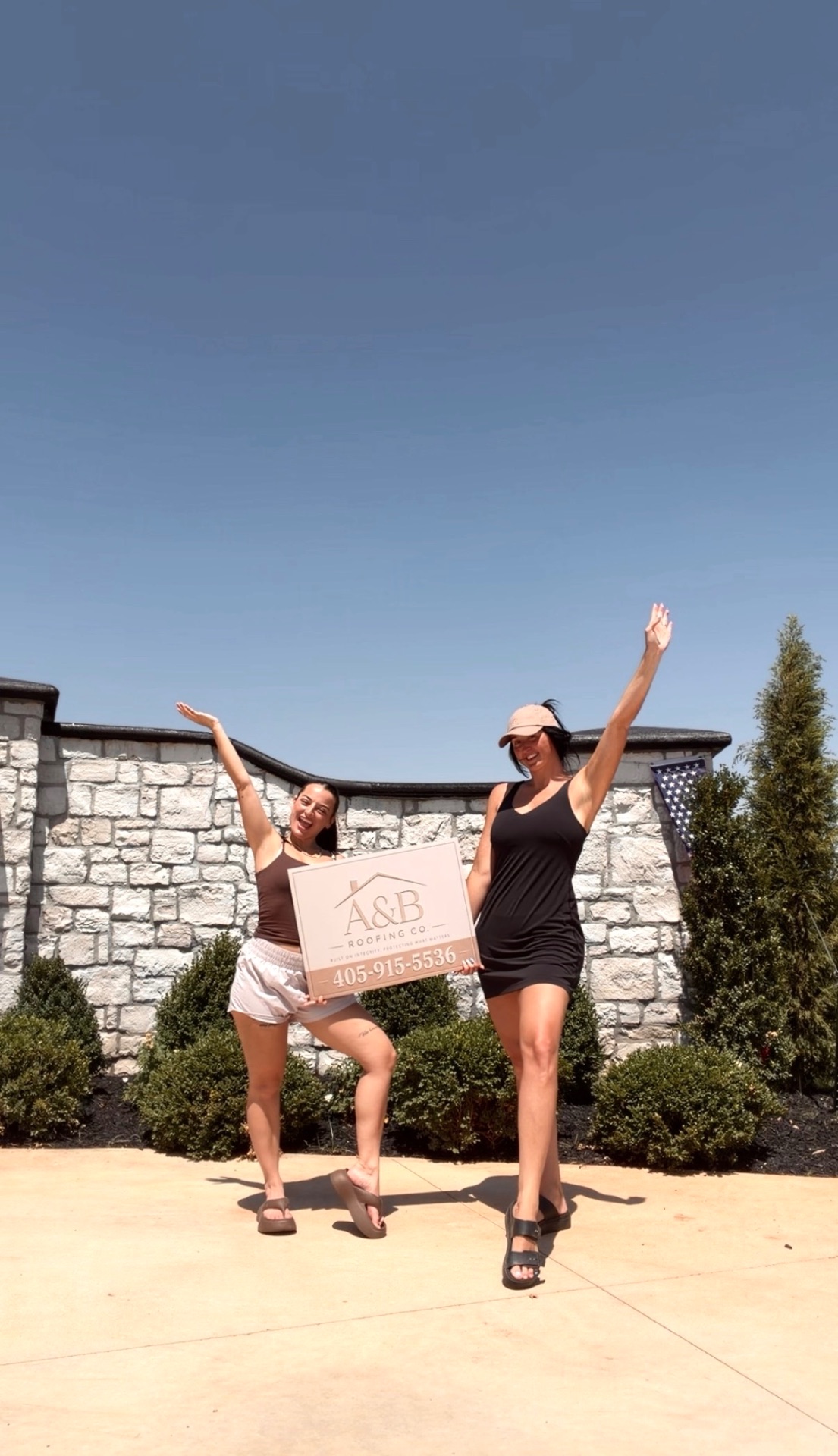 Brooklynn and Ameilla celebrating a finished roof